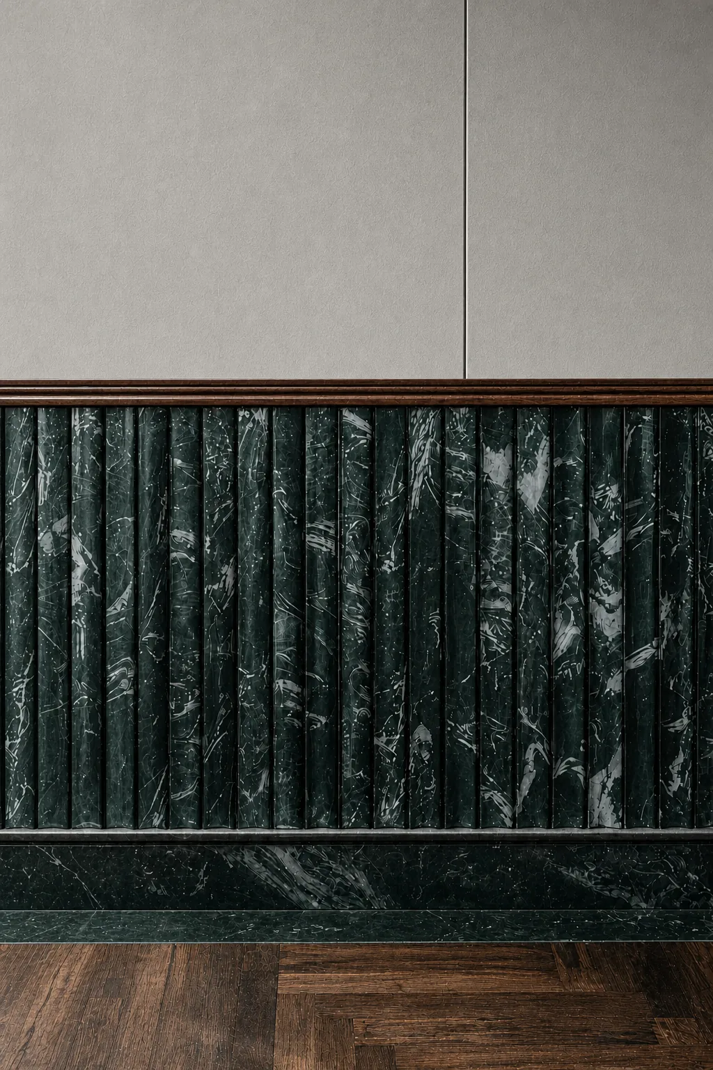 EPISODE Powai — Detail of slender fluted green marble staves, timber molding, and dark herringbone floor.