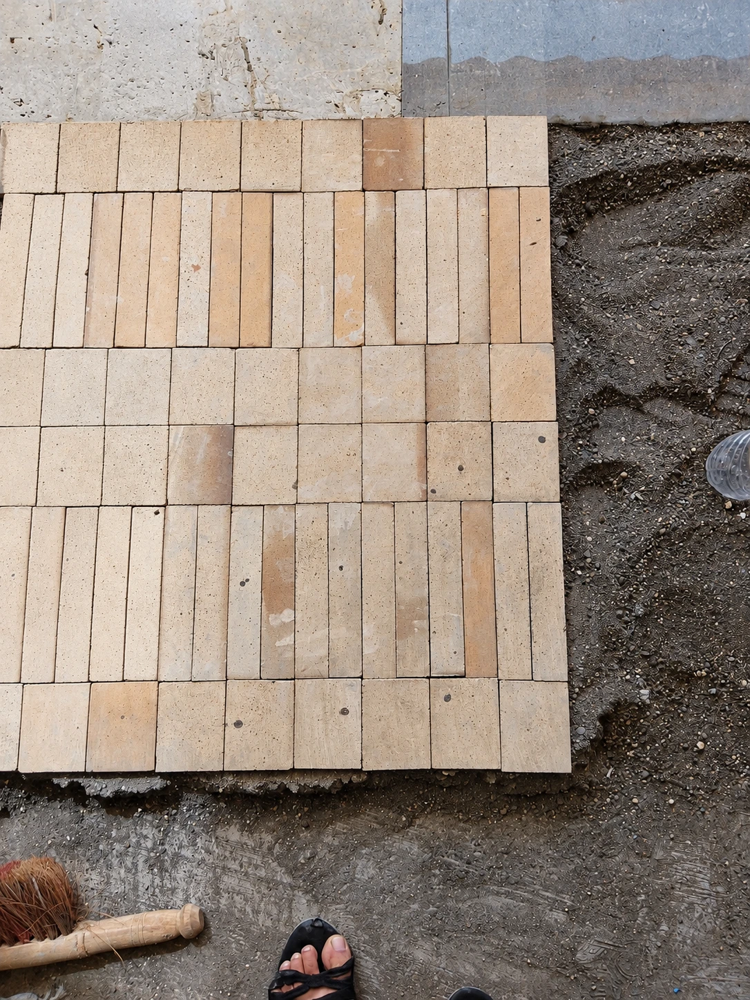 SOCIAL Vashi — Floor bond trial. A trial panel tests the rhythm of long and short masonry units before installation.